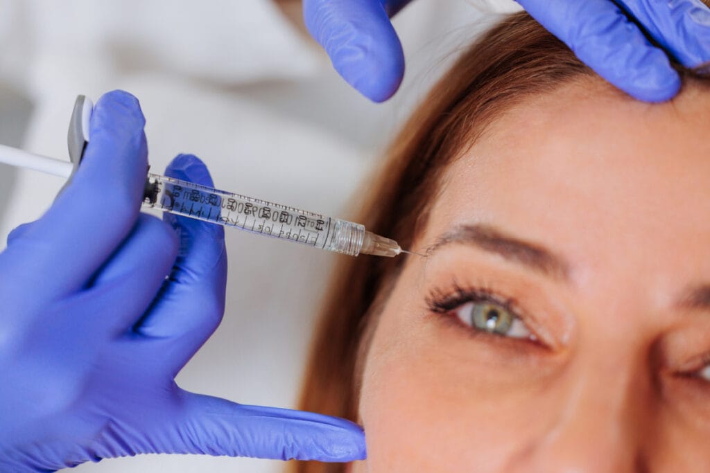 Woman getting Xeomin injections for crow's feet wrinkles